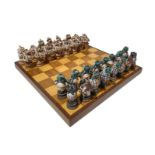 Wooden chessboard with majolica chess pieces