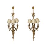 Pair of three lights applique in gilded bronze