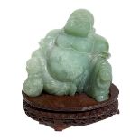 Green jade Buddha with wooden base