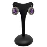 Earrings with faceted amethyst and ovals set with diamonds in 12 carat gold