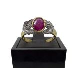 18 carat gold ring with oval ruby and ten 0,20 carat diamonds