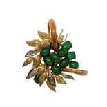 Brooch in gold and emeralds, 20th century