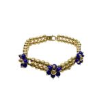 Two-strand beaded sphere bracelet in yellow gold and blue stones