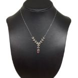 18 carat white gold necklace with central ruby and diamonds