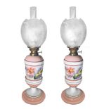 Belgica D.F. - Pair of ceramic oil lamps in white and pink with floral decorations and glass tulip b
