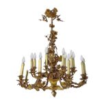 Large chandelier in bronze and gilded brass with mercury, 18 lights, with leaf ramage decorations.,