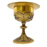 Chalice with paten in vermeil silver embossed with floral motifs, early 20th century. Based on relig