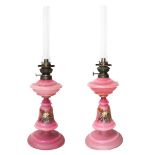 Pair of oil lamps in pink opalines, Early 20th century