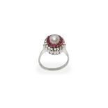 Silver ring with central pearl and round of brilliant cut diamonds and rubies