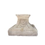 White stone plinth with flower decorations on the sides, XVIII century