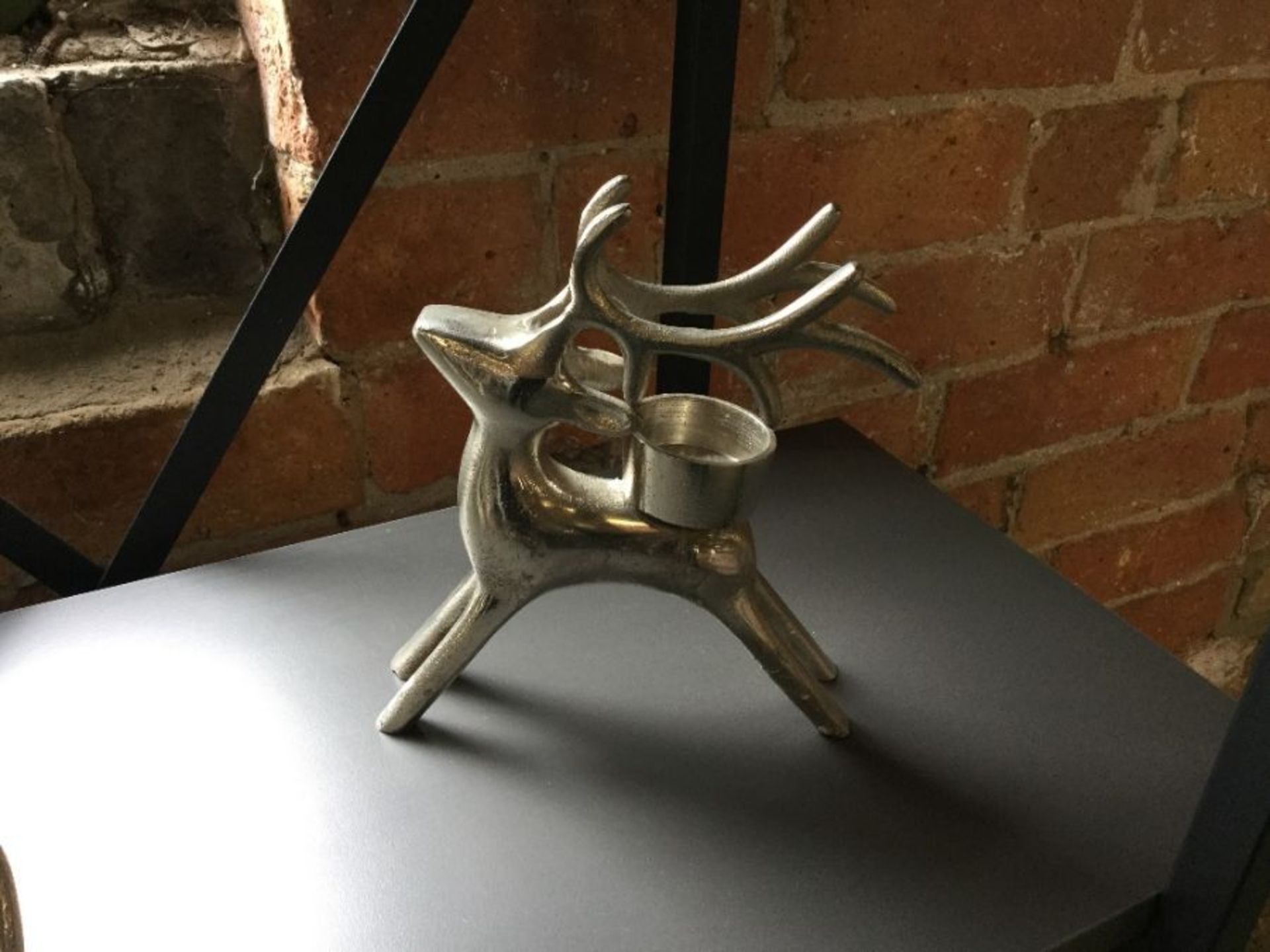 TEXTURED SILVER REINDEER TEALIGHT HOLDER