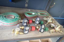 Lot of (2) NEW Oxy/Acetylene Hoses and (7) Asst. Gauges.