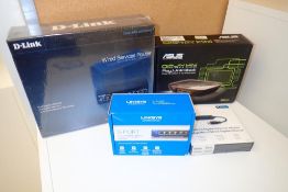 Lot of D-Link Router, Linksys Switch, Asus Media Player and D-Link Ethernet Adapter.