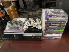 Playstation 3 w/ (2) Controllers, and (15) Games