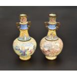 A NEAR PAIR OF CHINESE ENAMEL ‘EUROPEAN SUBJECT’ TWO-HANDLED VASES, QING DYNASTY