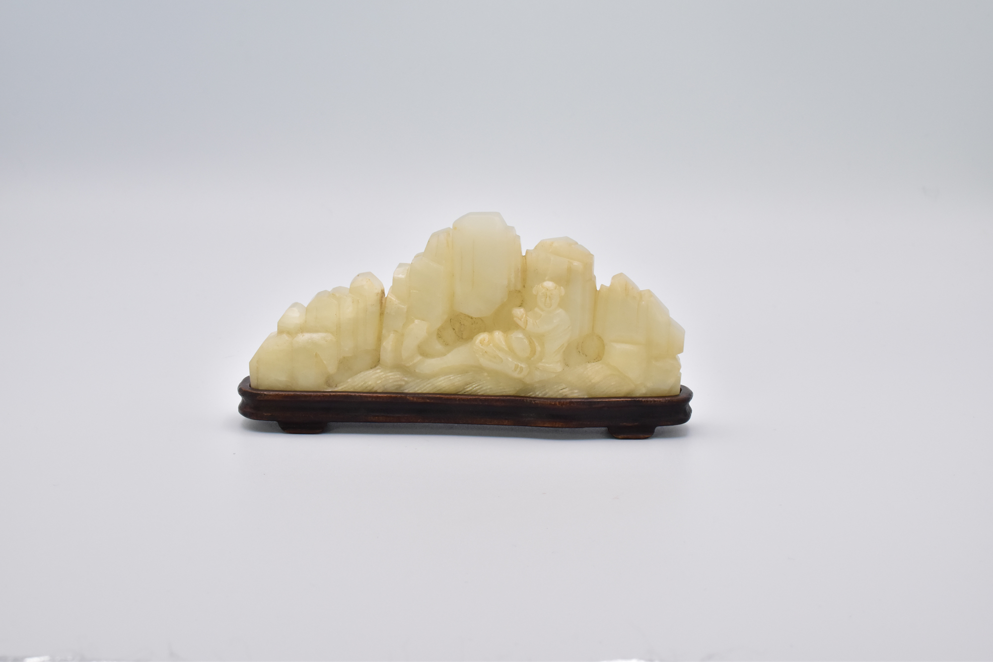 Ω A CHINESE CELADON JADE BRUSH HOLDER, 17TH CENTURY