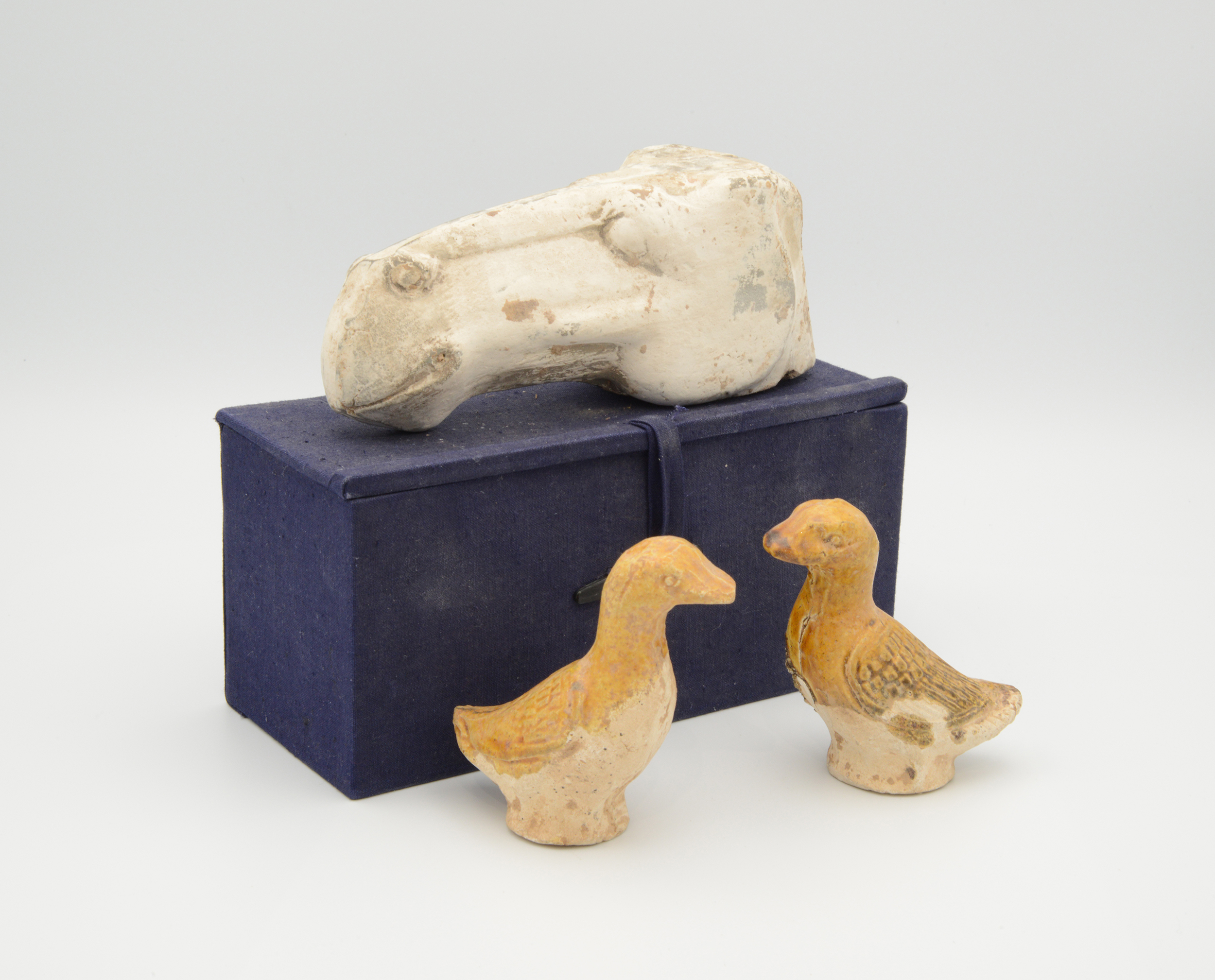 TWO CHINESE POTTERY STRAW-GLAZED MODELS OF DUCKS, TANG DYNASTY, 618 – 907 AD