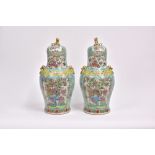 A LARGE PAIR OF CHINESE ‘FAMILLE-ROSE’ PORCELAIN VASES AND COVERS, QING DYNASTY, CIRCA 1900