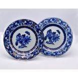 A PAIR OF CHINESE EXPORT BLUE AND WHITE ‘DUTCH-MARKET’ BOTANICAL PLATES, QIANLONG PERIOD, CIRCA 1740