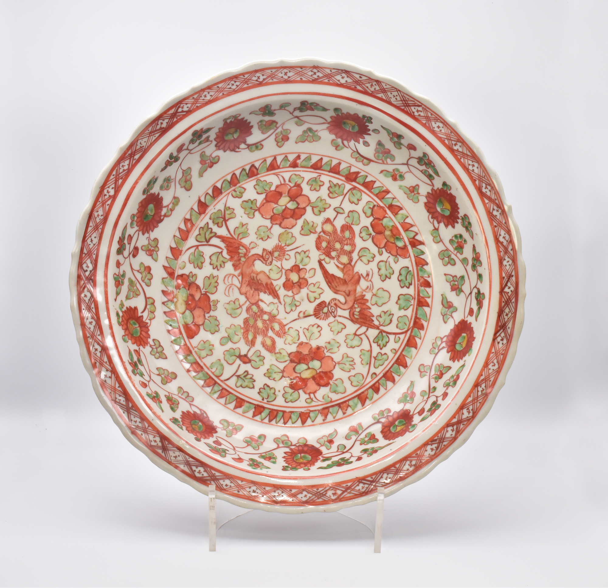 A CHINESE PORCELAIN IRON-RED ‘PEACOCK' DISH, LATE MING DYNASTY, 16TH CENTURY