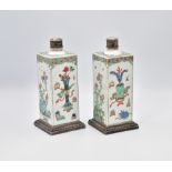 A PAIR OF CHINESE SILVER-MOUNTED ‘FAMILLE-VERTE’ BOTTLES AND COVERS, KANGXI PERIOD, THE MOUNTS LATER