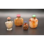 A GROUP OF FOUR CHINESE HARDSTONE SNUFF BOTTLES, QING DYNASTY, 19TH CENTURY