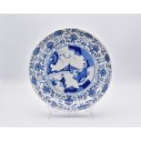 A CHINESE BLUE AND WHITE PORCELAIN SAUCER DISH, QING DYNASTY, KANGXI MARK AND PERIOD, 1662 – 1722