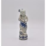 A CHINESE BLUE AND WHITE BOY, MING DYNASTY, WANLI PERIOD, 1573 - 1620