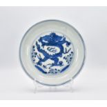 Ω A CHINESE BLUE AND WHITE PORCELAIN ‘DRAGON’ DISH, MING DYNASTY, WANLI PERIOD, 1573 - 1620