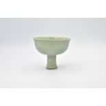 A CHINESE CELADON-GLAZED STEM CUP, MING DYNASTY
