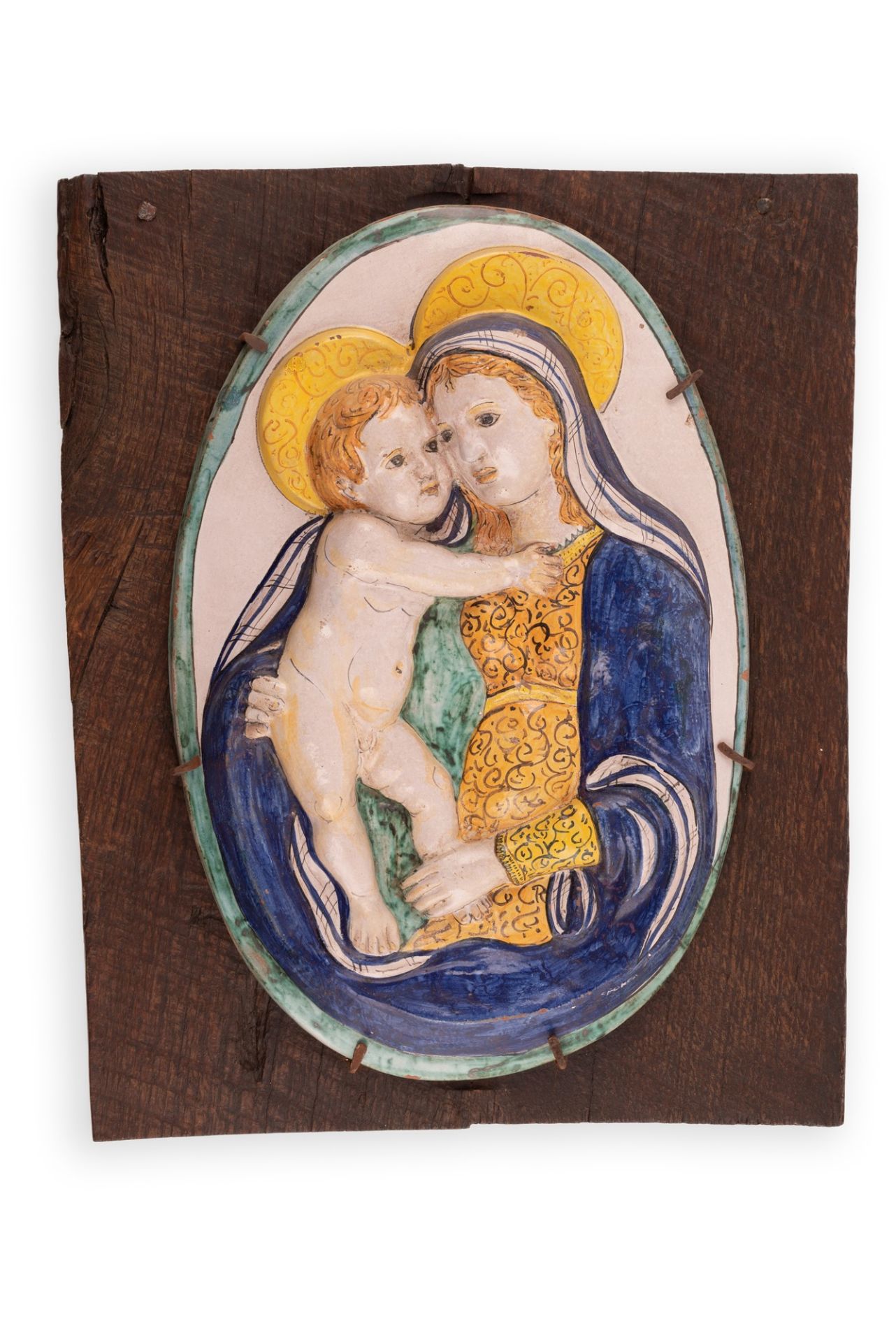 Bassorilievo ovale Madonna con Bambino su supporto ligneo