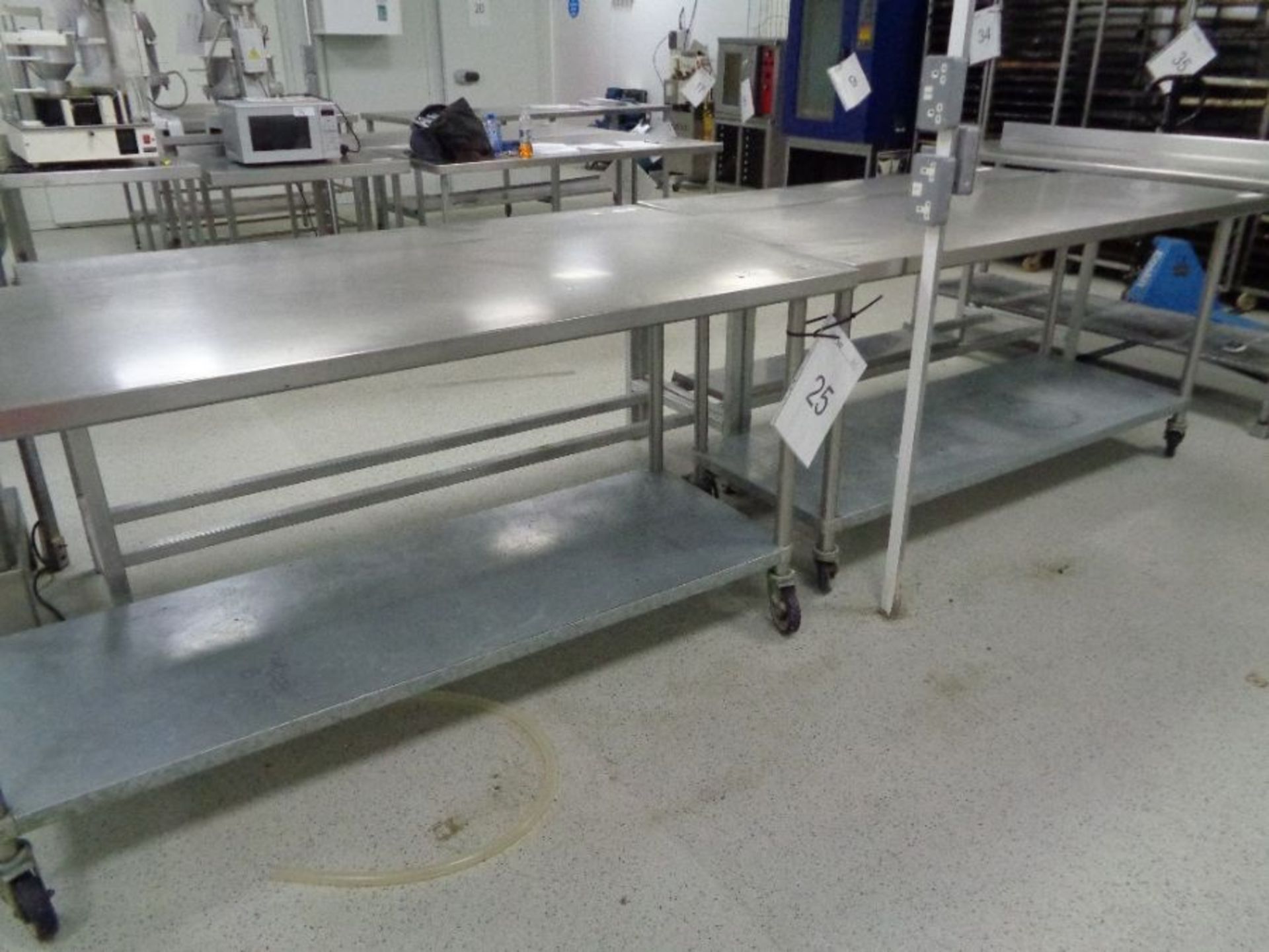 2 x Stainless Steel work tables 2m x 1m as lotted