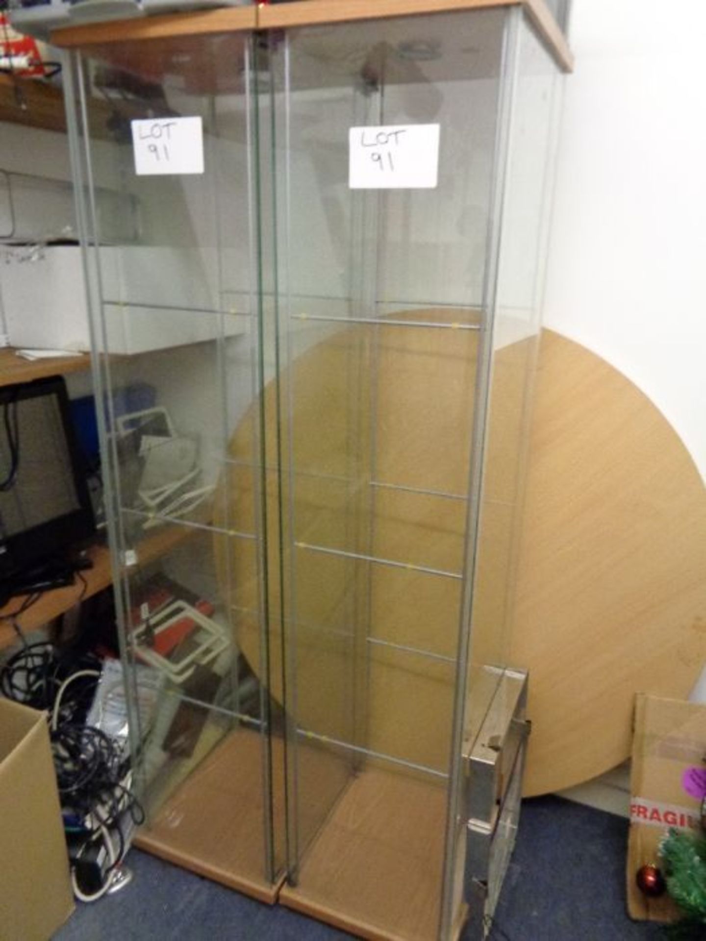 2 x Glass upright display cabinets as lotted