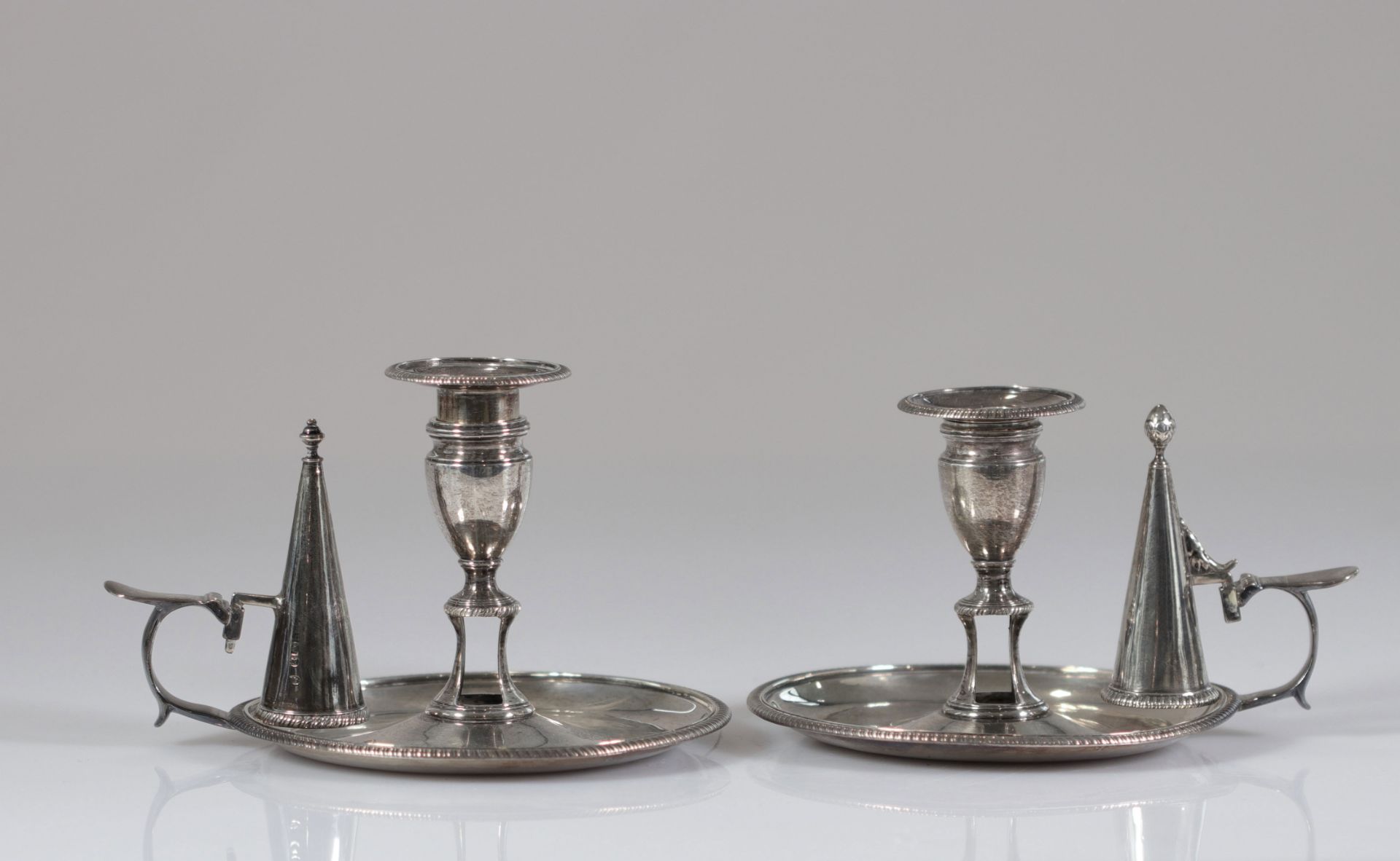 Pair of silver hand candlesticks with English hallmarks