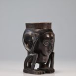 Kuba cup carved with a seated figure