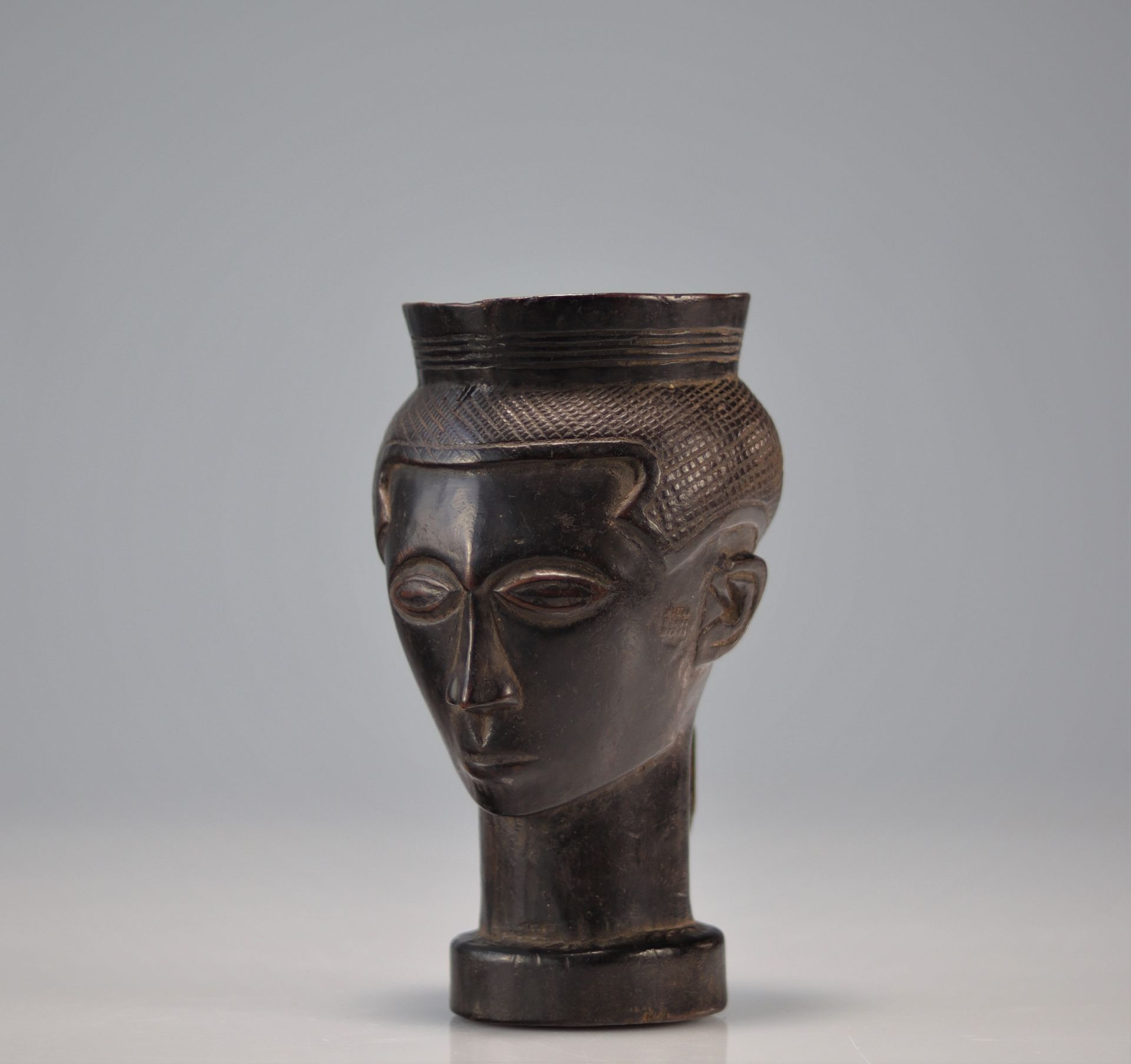Kuba cup carved with a head