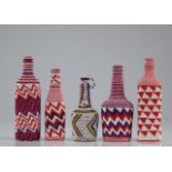 Set of beaded bottles with geometric patterns