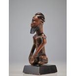 Bembe statue carved with a Finch & Co character through the worlds