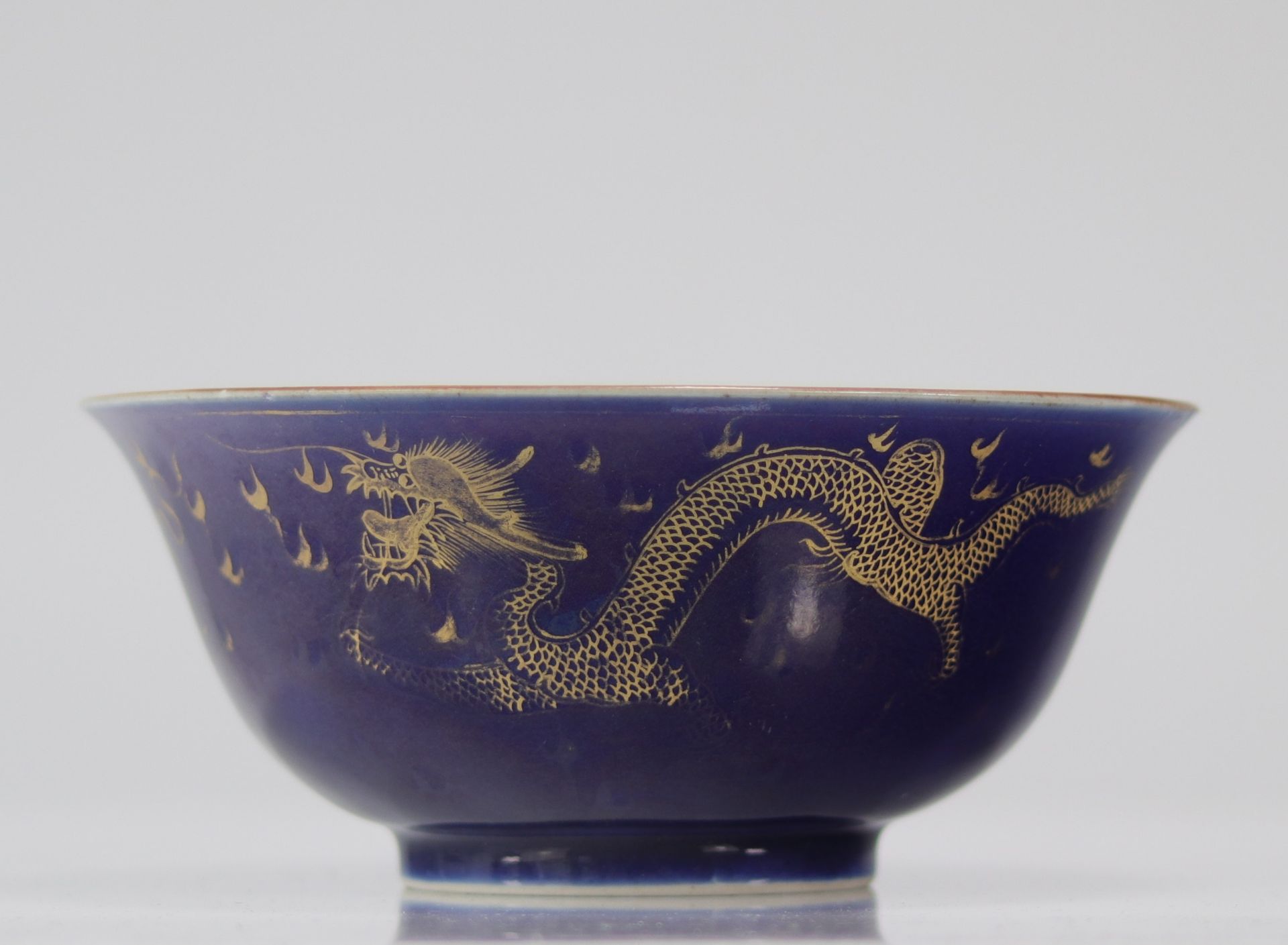 Large blue and gold powdered porcelain bowl with 18th century dragon decoration