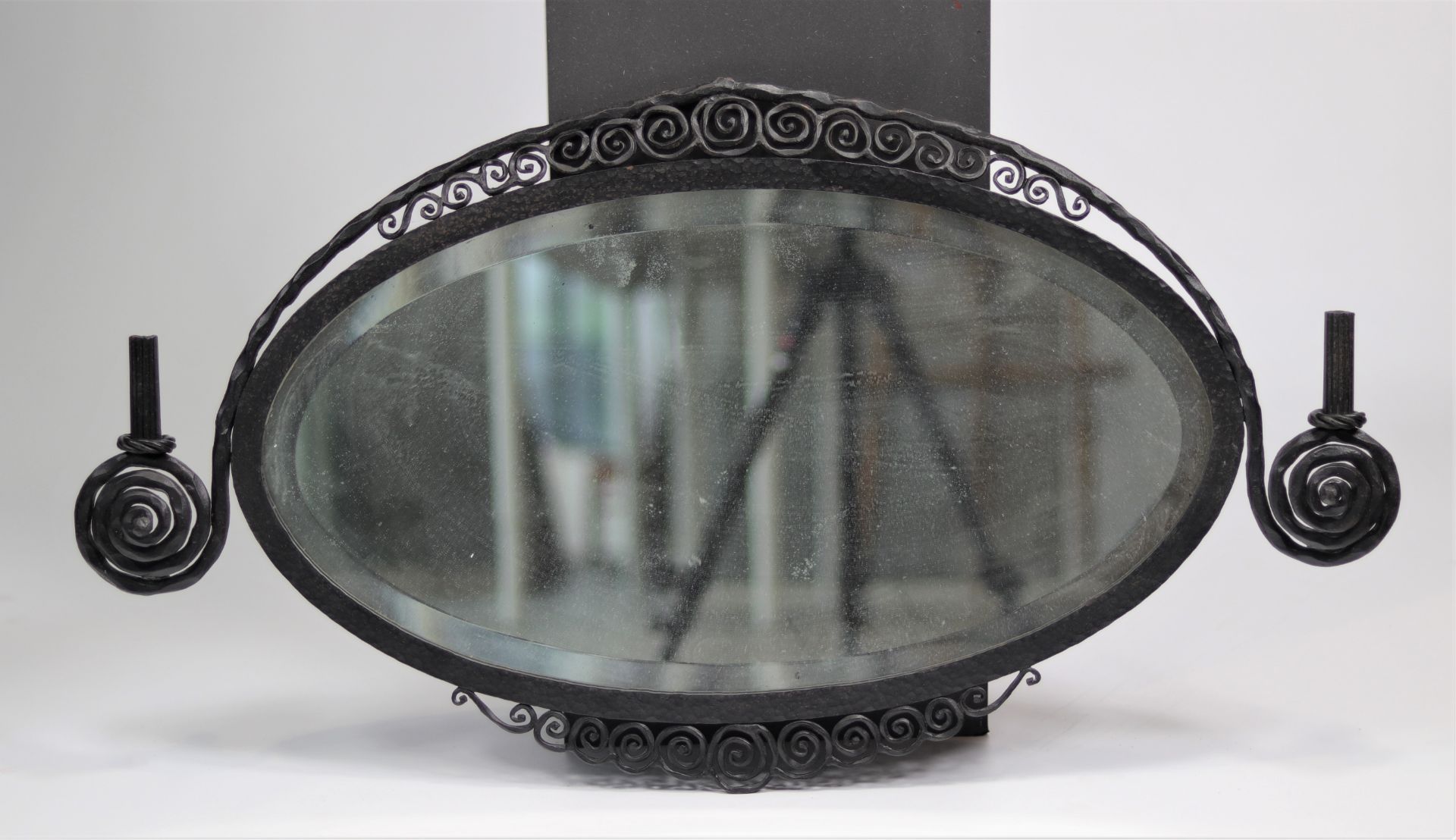 Art-deco mirror in wrought iron and bevelled glass, in the style of Paul Kiss, circa 1925