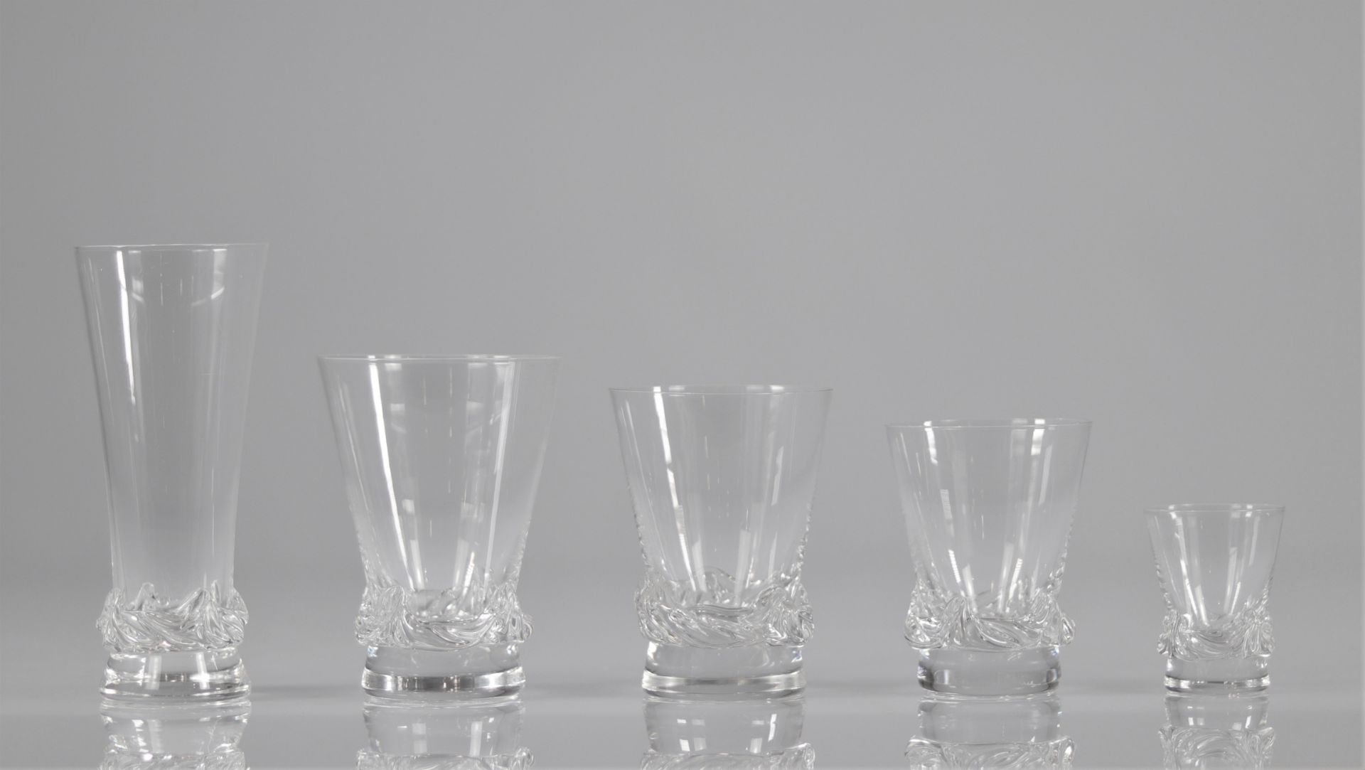 Daum Nancy Service of glasses (59pc) model Sorcy, the base with molded decoration of wavelets,