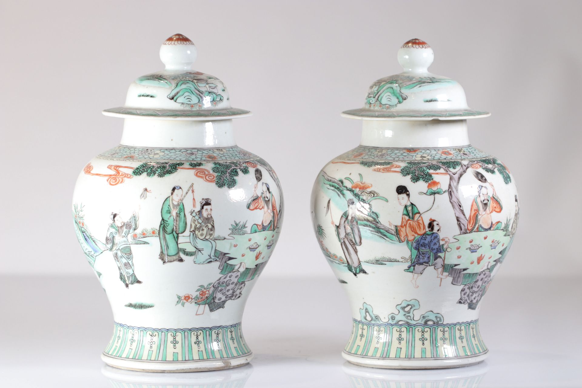 Pair of Qing dynasty famille verte covered vases decorated with figures