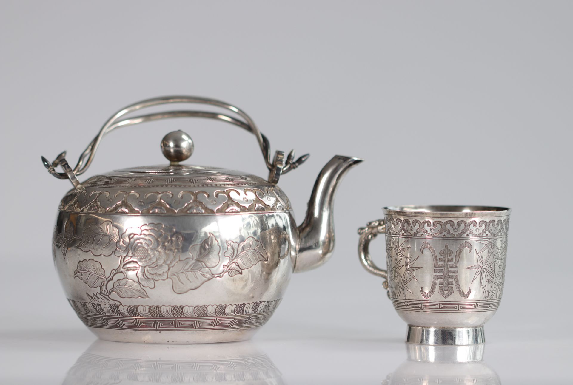 China silver teapot and cup