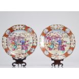 Pair of porcelain plates with Chinese plate holders