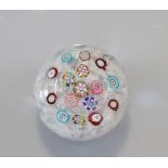 Baccarat paperweight with floral decoration on a 19th century lace background
