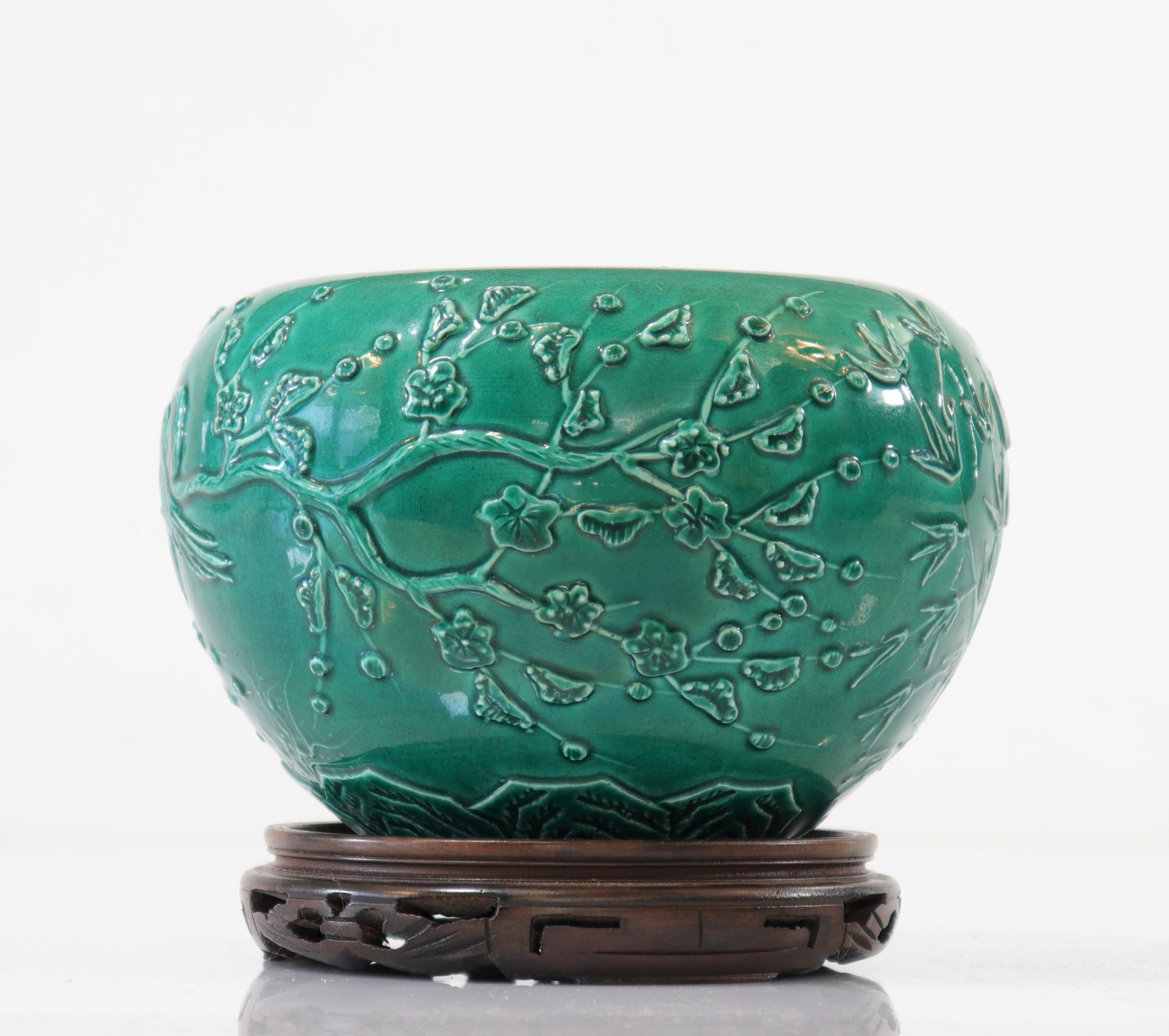 Chinese green porcelain vase with floral decoration marked under the piece