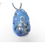 Lapis lazuli pendant carved with fish