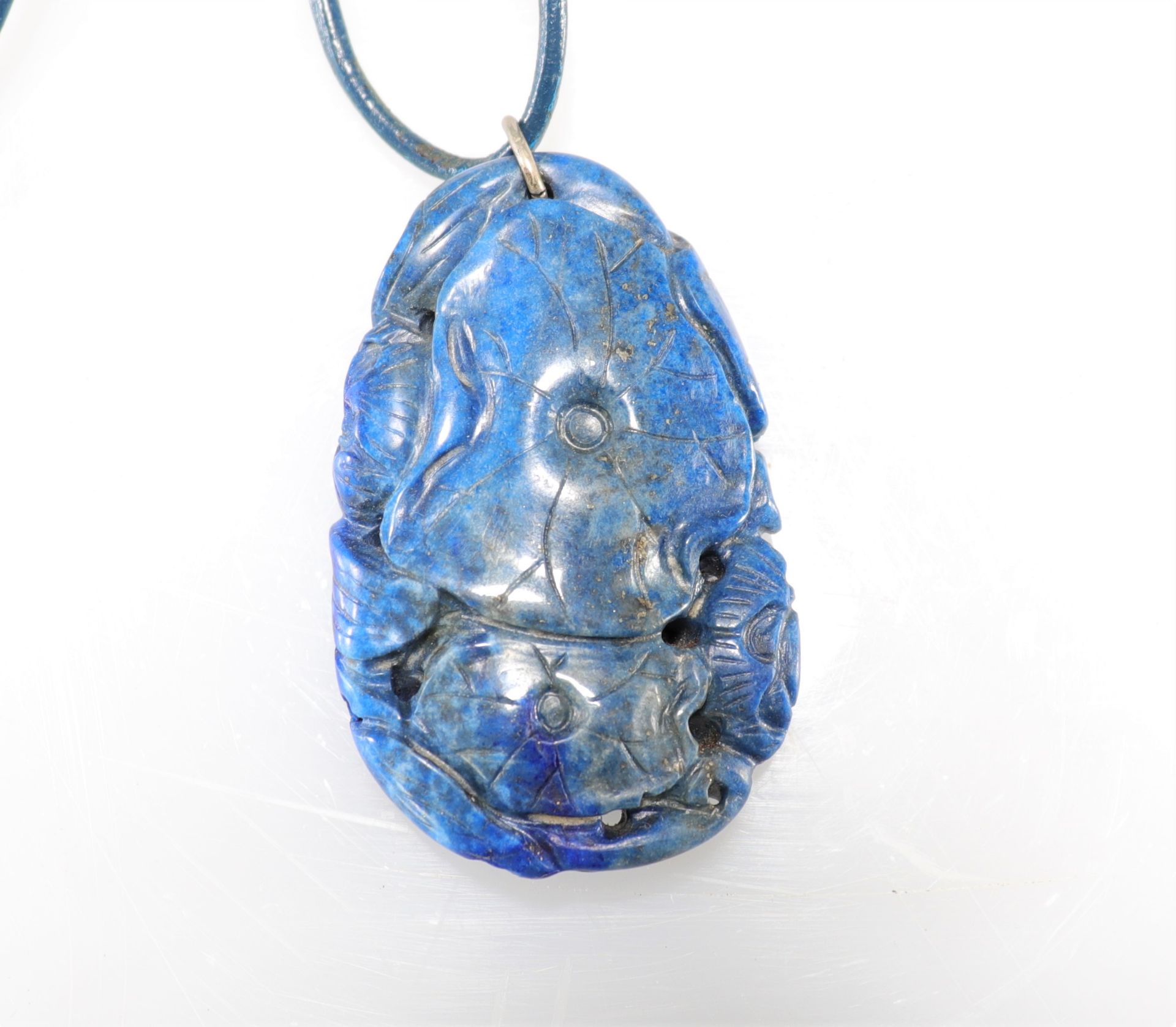 Lapis lazuli pendant carved with fish
