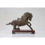 Bronze horse on wooden base