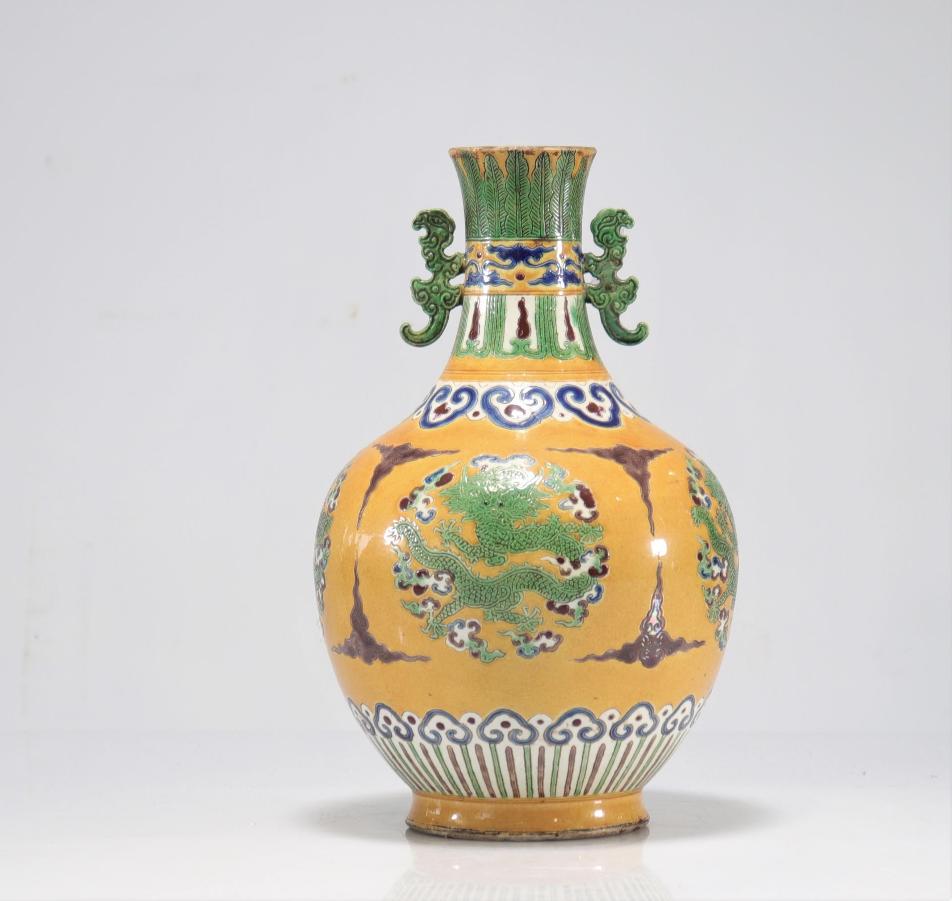 Glazed sandstone vase with yellow background decorated with imperial dragons